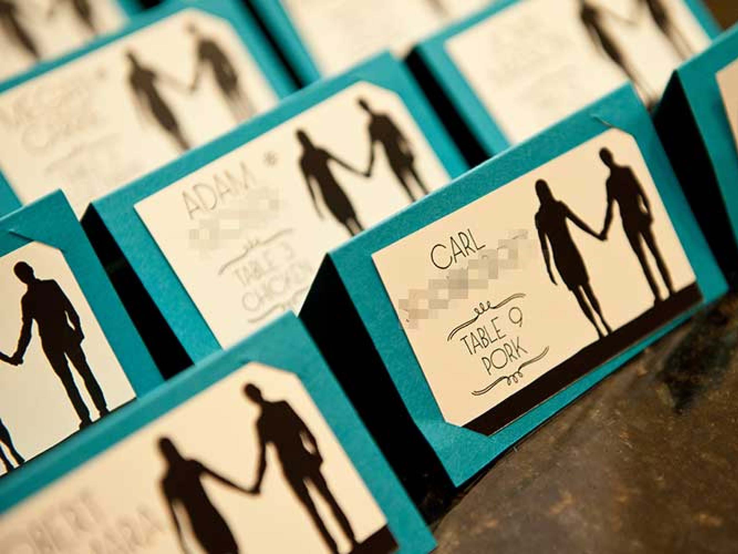 Wedding reception seating cards arranged on a tabletop.